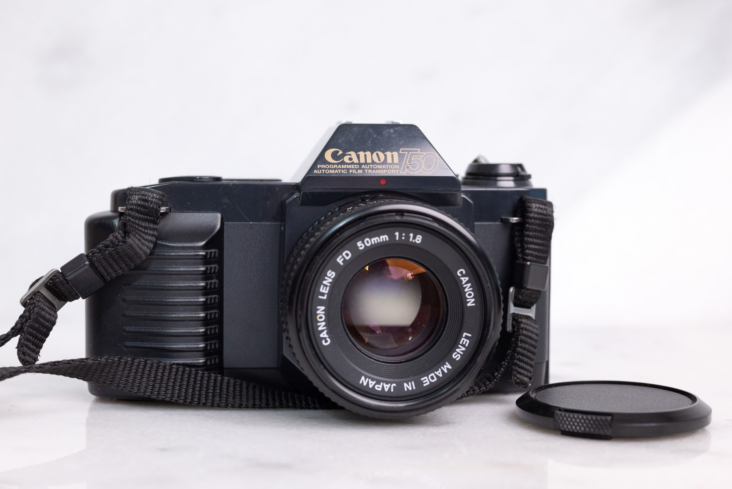 Canon T50 35mm Film SLR Camera with FD 50mm F/1.8 Fast Prime Lens